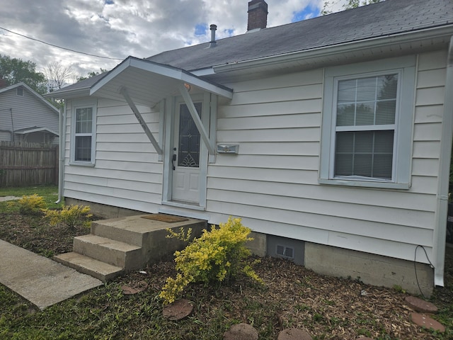 1629 W Webster St, Springfield, MO 65802 - entrance to property featuring fence, a chimney, and a shingled roof