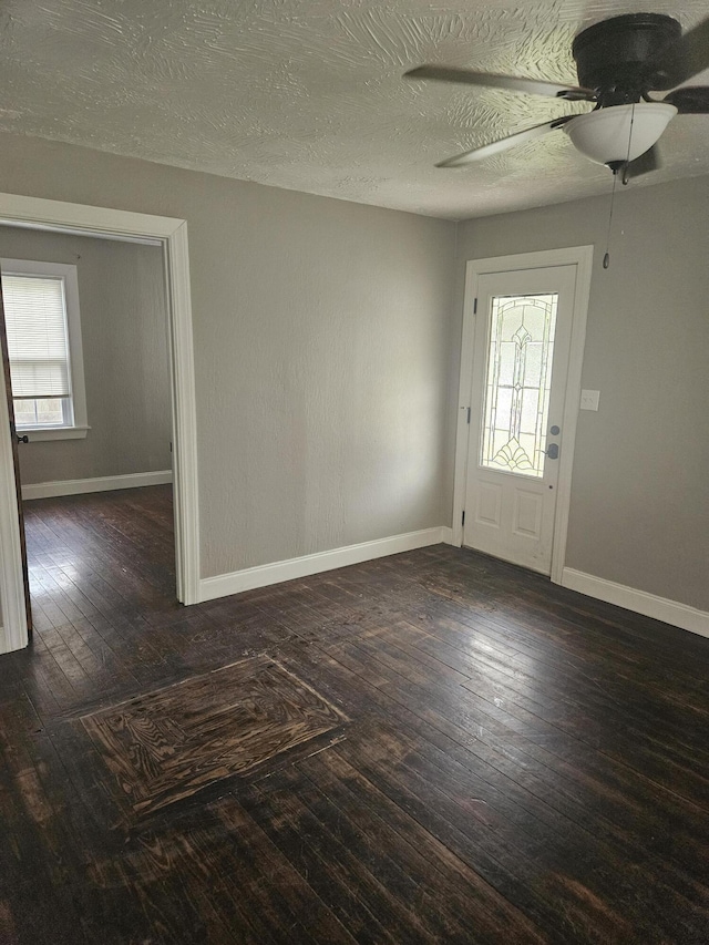 1629 W Webster St, Springfield, MO 65802 - foyer entrance with ceiling fan, baseboards, wood finished floors, and a textured ceiling