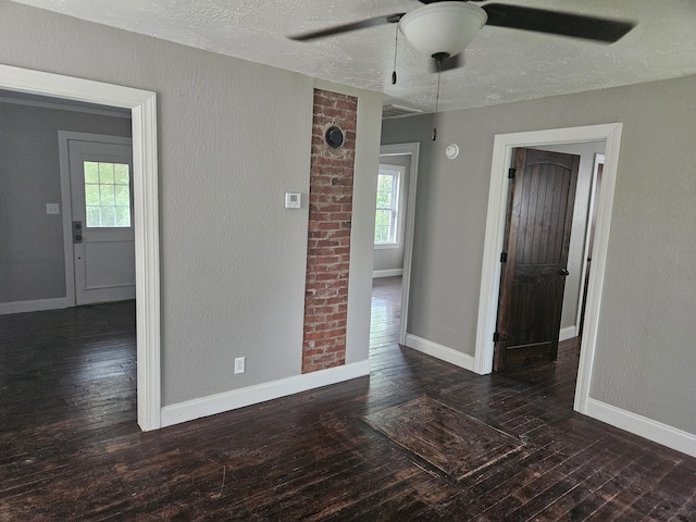 1629 W Webster St, Springfield, MO 65802 - empty room featuring a ceiling fan, hardwood / wood-style floors, plenty of natural light, baseboards, and a textured ceiling