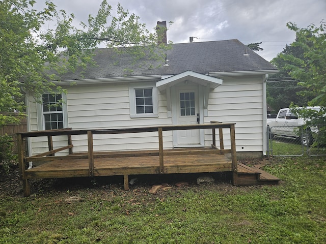 1629 W Webster St, Springfield, MO 65802 - rear view of property featuring a wooden deck, a chimney, and a shingled roof