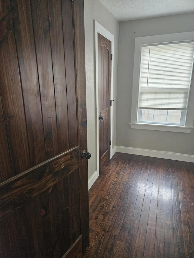 1629 W Webster St, Springfield, MO 65802 - hall featuring dark wood-style flooring and baseboards