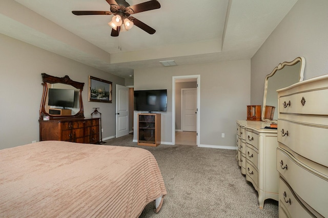 1918 N Brook Hollow Dr, Nixa, MO 65714 - bedroom featuring baseboards, light colored carpet, a tray ceiling, and ceiling fan