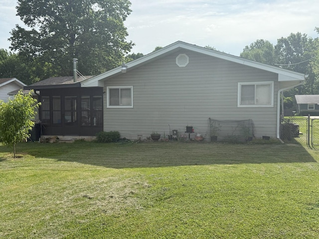 view of side of property with a sunroom