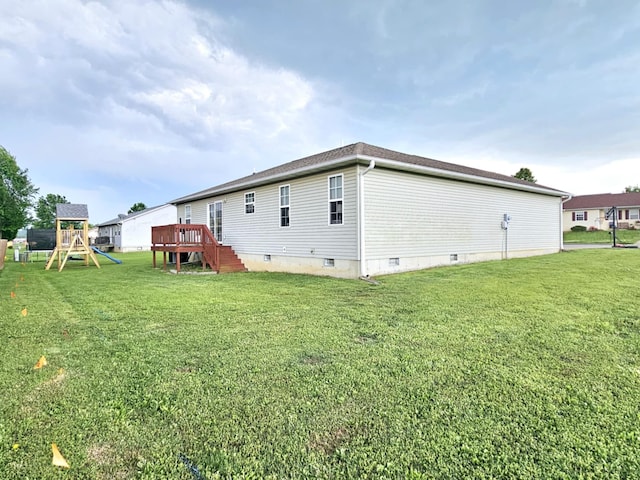 1620 Jon St, West Plains, MO 65775 - back of property with crawl space, a lawn, a deck, and a playground