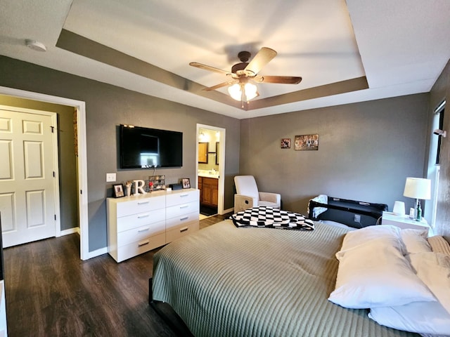 1620 Jon St, West Plains, MO 65775 - bedroom with a raised ceiling, wood finished floors, baseboards, a ceiling fan, and ensuite bathroom