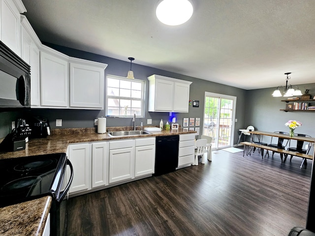 1620 Jon St, West Plains, MO 65775 - kitchen with black appliances, a sink, dark wood-style flooring, white cabinets, and decorative light fixtures