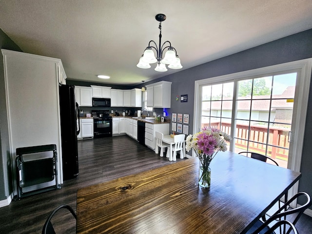 1620 Jon St, West Plains, MO 65775 - dining room featuring dark wood-style floors, a chandelier, and baseboards