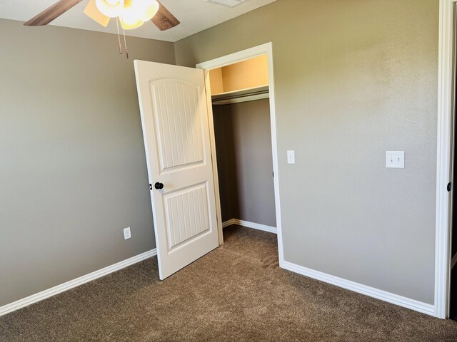 4692 S 125th Rd, Bolivar, MO 65613 - unfurnished bedroom with dark colored carpet, baseboards, and a closet