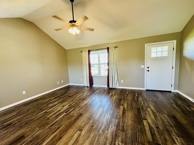 4692 S 125th Rd, Bolivar, MO 65613 - unfurnished living room featuring lofted ceiling, dark wood-style flooring, a ceiling fan, and baseboards
