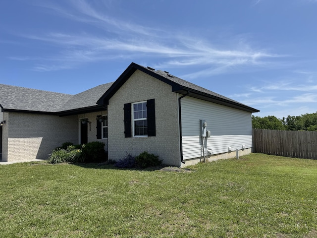 4692 S 125th Rd, Bolivar, MO 65613 - view of side of property featuring brick siding and roof with shingles