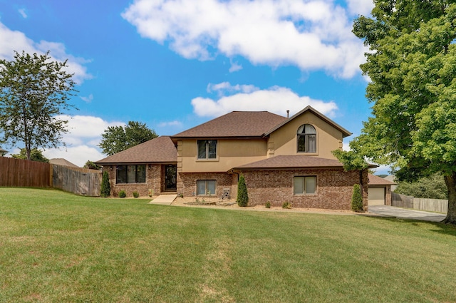 2019 N Preakness Dr, Nixa, MO 65714 - view of front facade featuring brick siding, concrete driveway, stucco siding, and a shingled roof