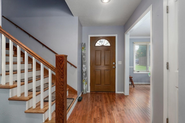 2019 N Preakness Dr, Nixa, MO 65714 - foyer entrance with baseboards, wood finished floors, and stairway