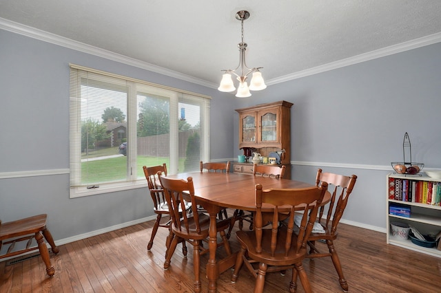 2019 N Preakness Dr, Nixa, MO 65714 - dining area with a chandelier, hardwood / wood-style flooring, crown molding, and baseboards