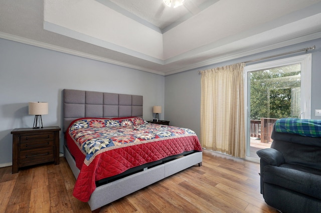 2019 N Preakness Dr, Nixa, MO 65714 - bedroom with wood-type flooring, access to exterior, and a raised ceiling