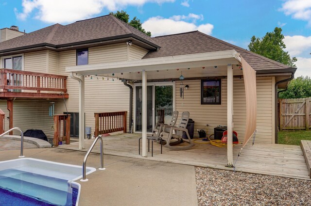 2019 N Preakness Dr, Nixa, MO 65714 - back of house featuring a shingled roof, a deck, fence, and a patio area
