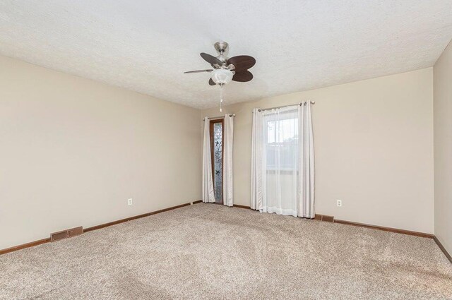 3729 S Parklane Ave, Springfield, MO 65807 - unfurnished room with carpet floors, ceiling fan, baseboards, and a textured ceiling