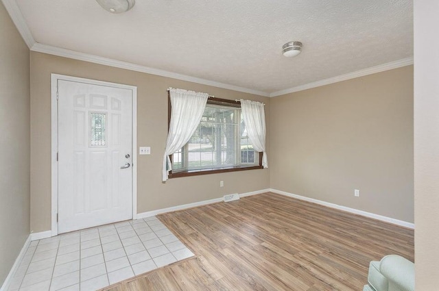 3729 S Parklane Ave, Springfield, MO 65807 - entrance foyer featuring light wood-style floors, crown molding, baseboards, and a textured ceiling