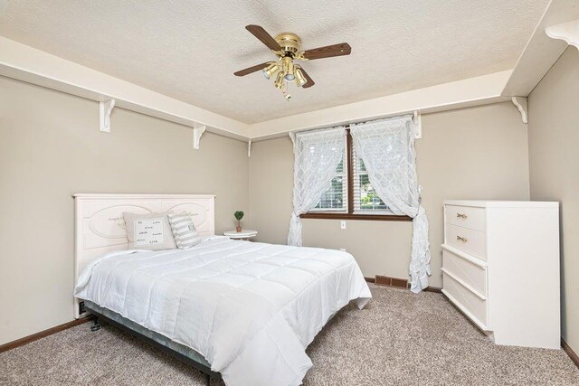 3729 S Parklane Ave, Springfield, MO 65807 - bedroom with carpet, baseboards, a textured ceiling, and ceiling fan