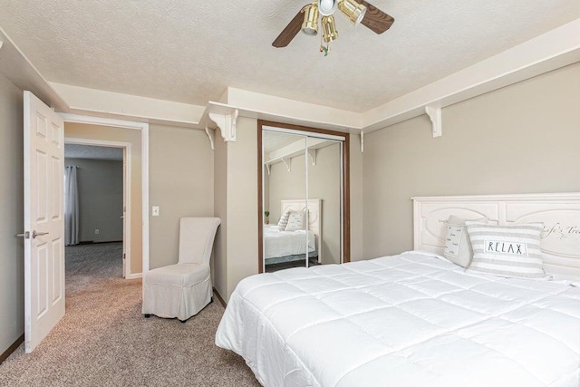 3729 S Parklane Ave, Springfield, MO 65807 - bedroom with carpet flooring, a textured ceiling, a closet, and ceiling fan