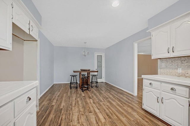 3729 S Parklane Ave, Springfield, MO 65807 - dining room featuring light wood-style floors and baseboards