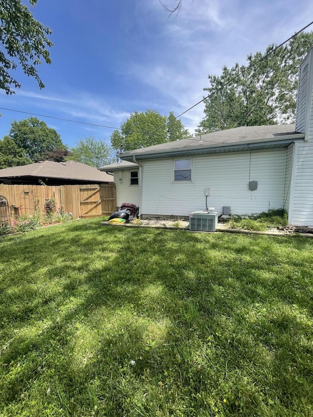 3729 S Parklane Ave, Springfield, MO 65807 - back of house featuring central AC and a chimney