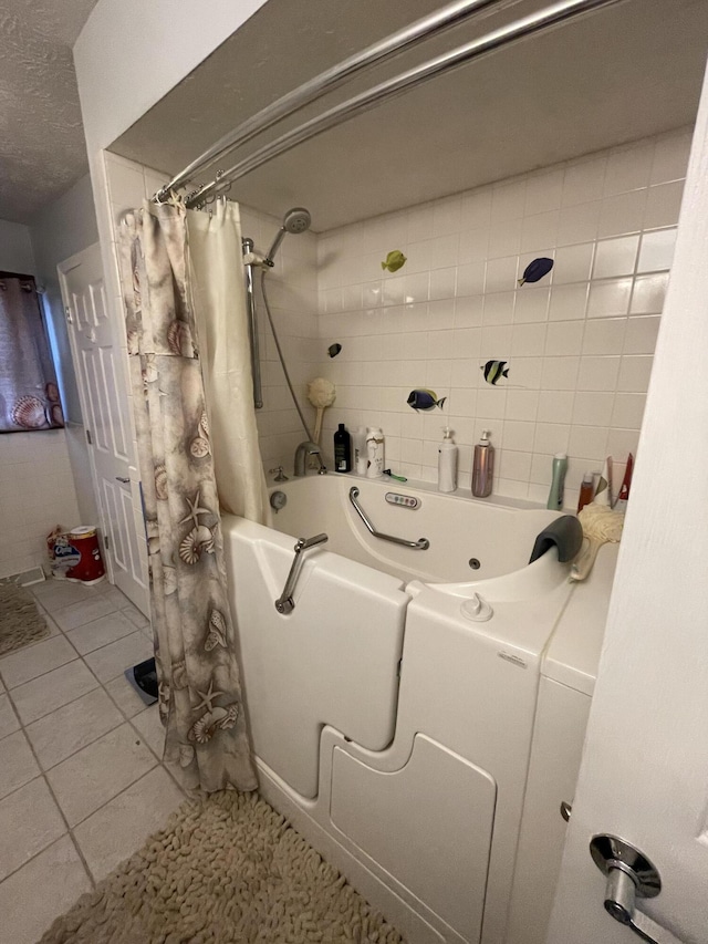 3729 S Parklane Ave, Springfield, MO 65807 - bathroom with a combined bath / shower with jetted tub and a textured ceiling