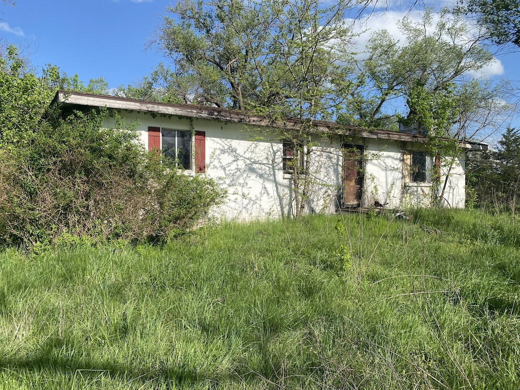 19999 Auburn Rd, Hermitage, MO 65668 - obstructed view of property with stucco siding