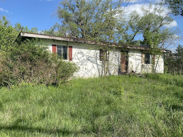 19999 Auburn Rd, Hermitage, MO 65668 - obstructed view of property with stucco siding