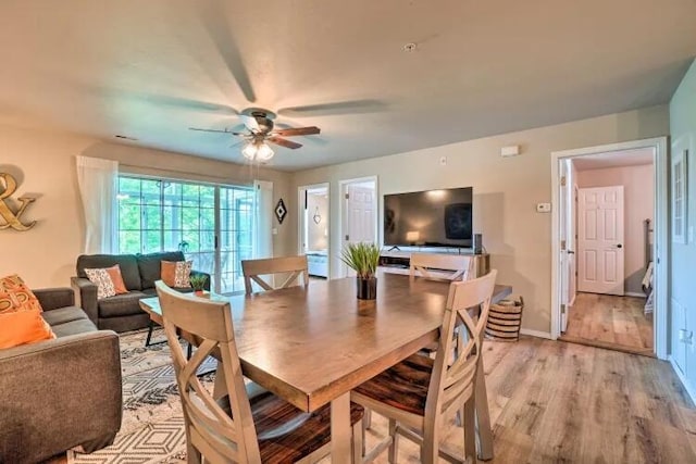 120 Spring Creek Ct Unit 12, Branson, MO 65616 - dining room with a ceiling fan, light wood finished floors, and baseboards
