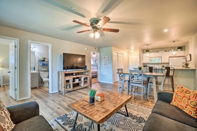 120 Spring Creek Ct Unit 12, Branson, MO 65616 - living area with ceiling fan, light wood-type flooring, and baseboards