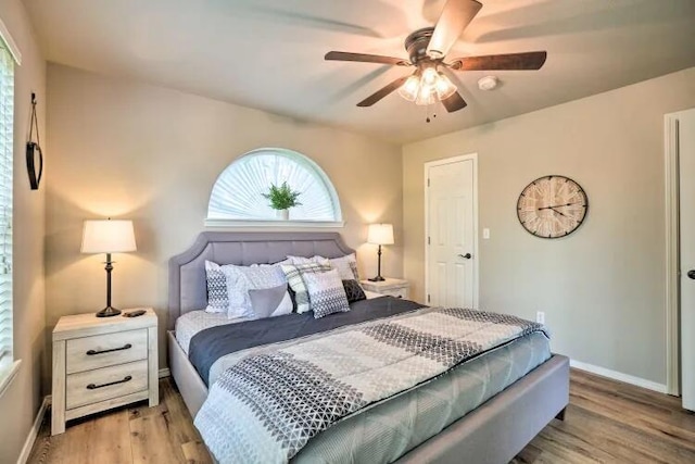 120 Spring Creek Ct Unit 12, Branson, MO 65616 - bedroom featuring light wood-style floors, baseboards, and a ceiling fan