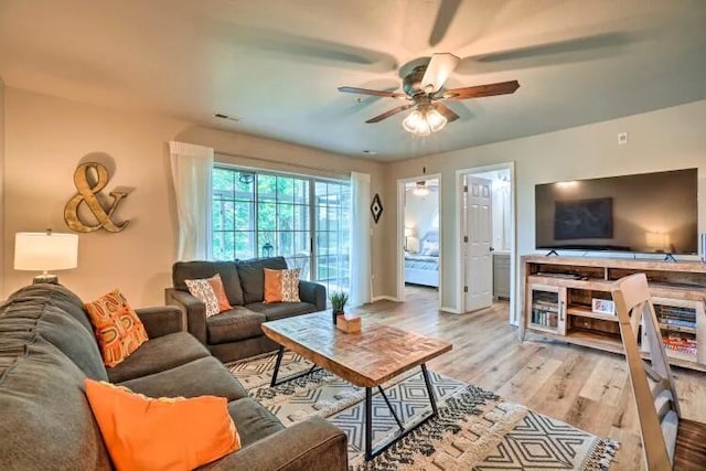 120 Spring Creek Ct Unit 12, Branson, MO 65616 - living room featuring ceiling fan, light wood finished floors, and baseboards