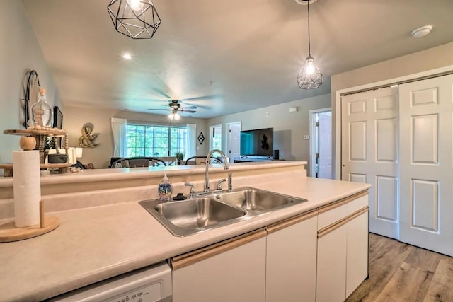120 Spring Creek Ct Unit 12, Branson, MO 65616 - kitchen featuring a sink, white cabinetry, pendant lighting, and light countertops