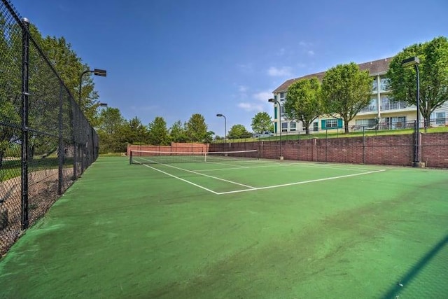 120 Spring Creek Ct Unit 12, Branson, MO 65616 - view of tennis court featuring fence