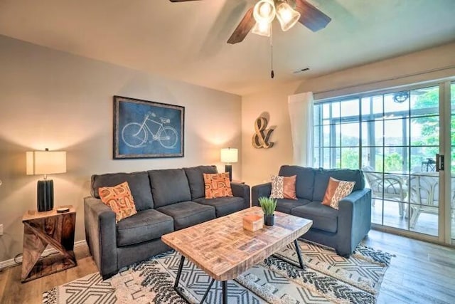 120 Spring Creek Ct Unit 12, Branson, MO 65616 - living room with wood finished floors, a ceiling fan, and baseboards