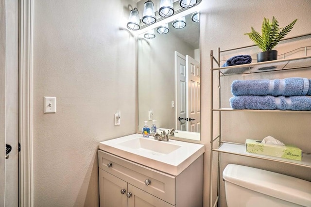 120 Spring Creek Ct Unit 12, Branson, MO 65616 - half bath with toilet, vanity, and a textured wall