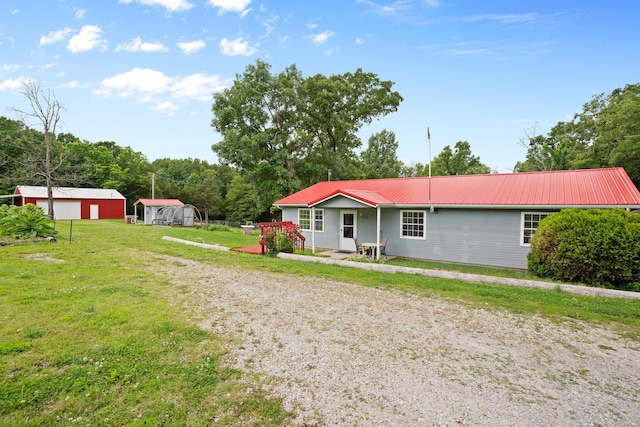 1356 State Highway 32, Long Lane, MO 65590 - ranch-style house with a garage, metal roof, a front yard, and driveway