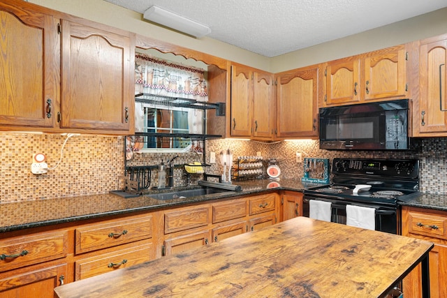 1356 State Highway 32, Long Lane, MO 65590 - kitchen featuring black appliances, a sink, decorative backsplash, dark stone counters, and a textured ceiling