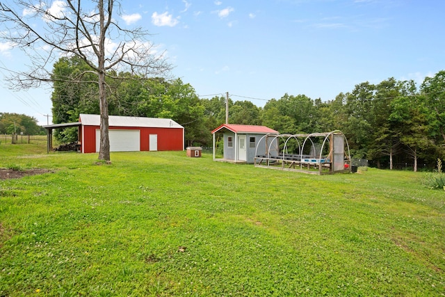 1356 State Highway 32, Long Lane, MO 65590 - view of grassy yard featuring an outdoor structure and a garage