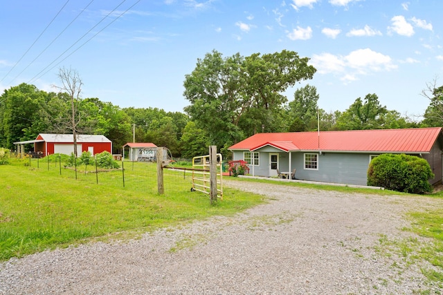 1356 State Highway 32, Long Lane, MO 65590 - view of front facade with gravel driveway, metal roof, and a garage