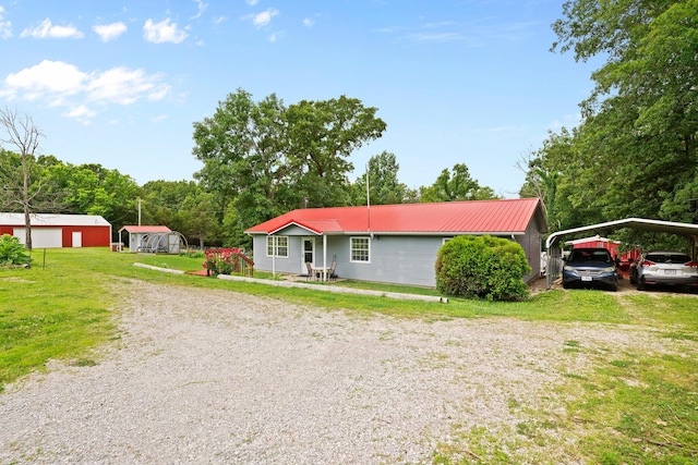 1356 State Highway 32, Long Lane, MO 65590 - ranch-style home featuring driveway, metal roof, a front lawn, and a detached carport
