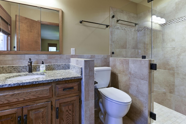 1605 Hideaway Rd, Galena, MO 65656 - full bathroom featuring a stall shower, tile walls, toilet, and vanity