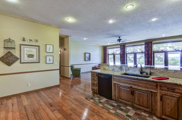 1605 Hideaway Rd, Galena, MO 65656 - kitchen featuring black dishwasher, a sink, ornamental molding, a textured ceiling, and dark wood-style floors
