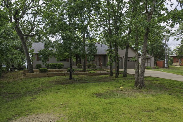 1605 Hideaway Rd, Galena, MO 65656 - view of front of home featuring concrete driveway, a front yard, and a shingled roof