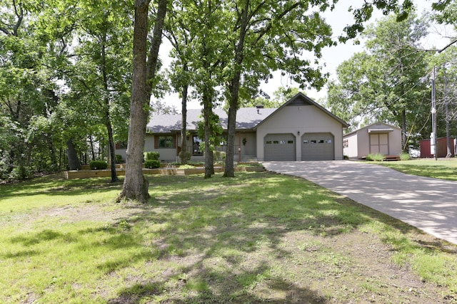 1605 Hideaway Rd, Galena, MO 65656 - ranch-style home with concrete driveway, an attached garage, and a front lawn