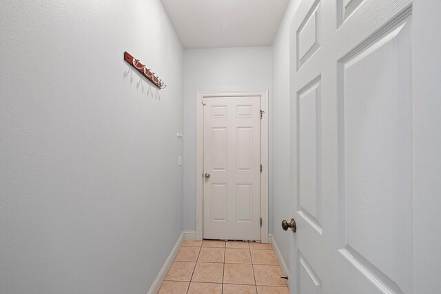 2310 Lakeside Ct, Ozark, MO 65721 - doorway featuring light tile patterned floors and baseboards