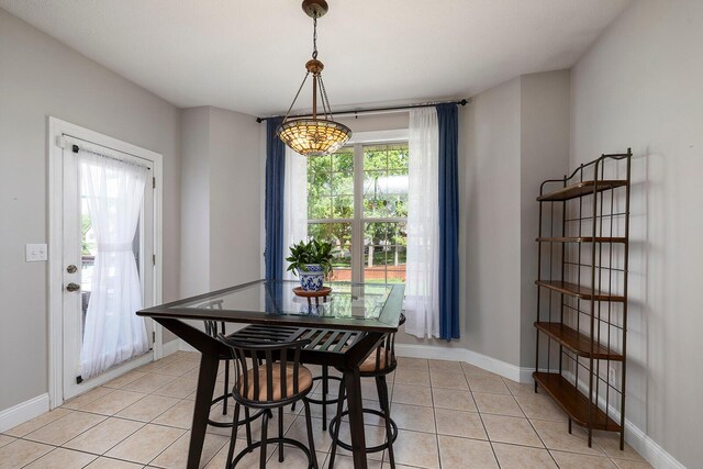 2310 Lakeside Ct, Ozark, MO 65721 - dining space featuring light tile patterned floors and baseboards
