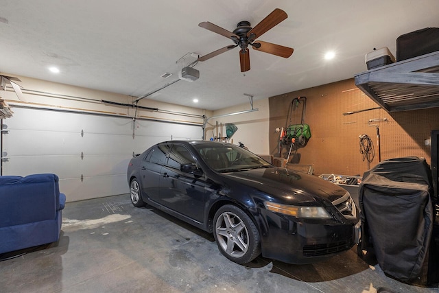 2310 Lakeside Ct, Ozark, MO 65721 - garage featuring a garage door opener, a ceiling fan, and recessed lighting