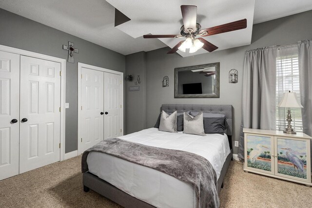 2310 Lakeside Ct, Ozark, MO 65721 - bedroom with two closets, carpet flooring, baseboards, and ceiling fan