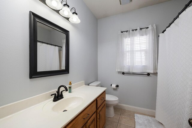 2310 Lakeside Ct, Ozark, MO 65721 - bathroom featuring tile patterned flooring, vanity, toilet, and baseboards